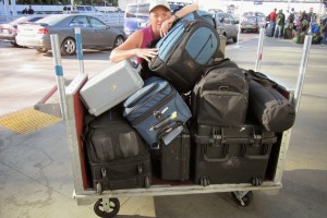 Annie with 7 bags of photographic equipment, and one tiny suitcase of personal items!