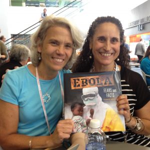 Brenda Kahn (L) and Patricia Newman at ALA celebrating the release of EBOLA: FEARS AND FACTS.