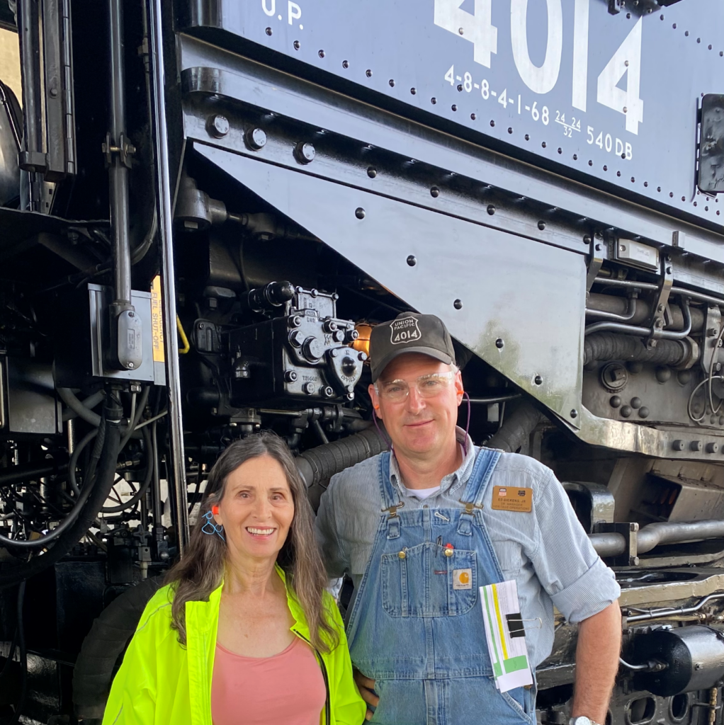 Marsha-Diane-Arnold-with-Ed-Dickens,-Big-Boy-4014-engineer-and-leader-of-the-Steam-Team